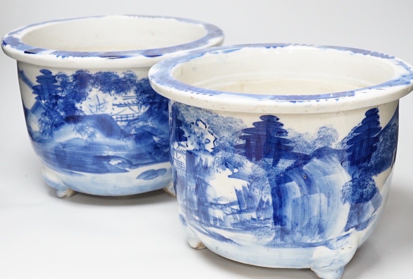 A pair of Japanese blue and white jardinieres, 31cm diameter